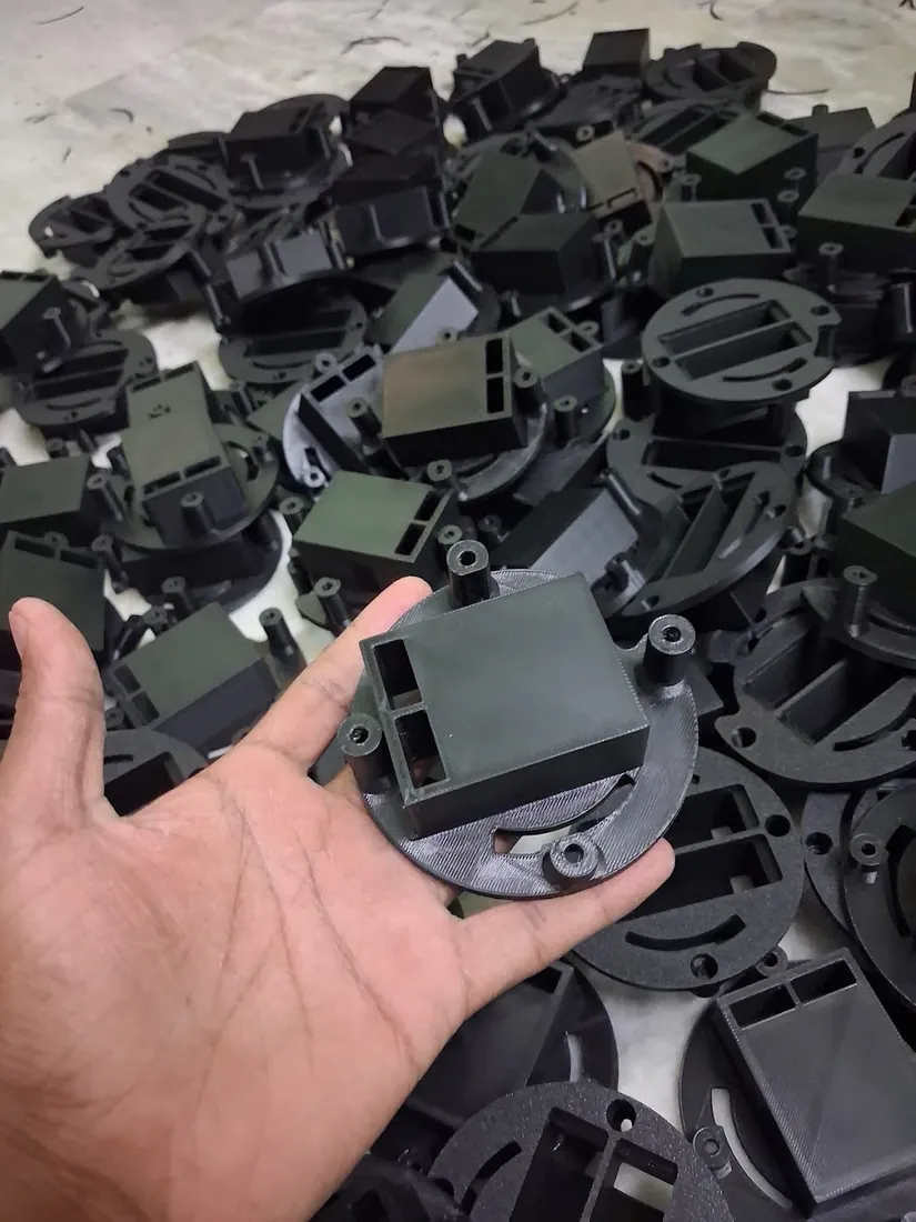 Batch of black 3D printed enclosure parts